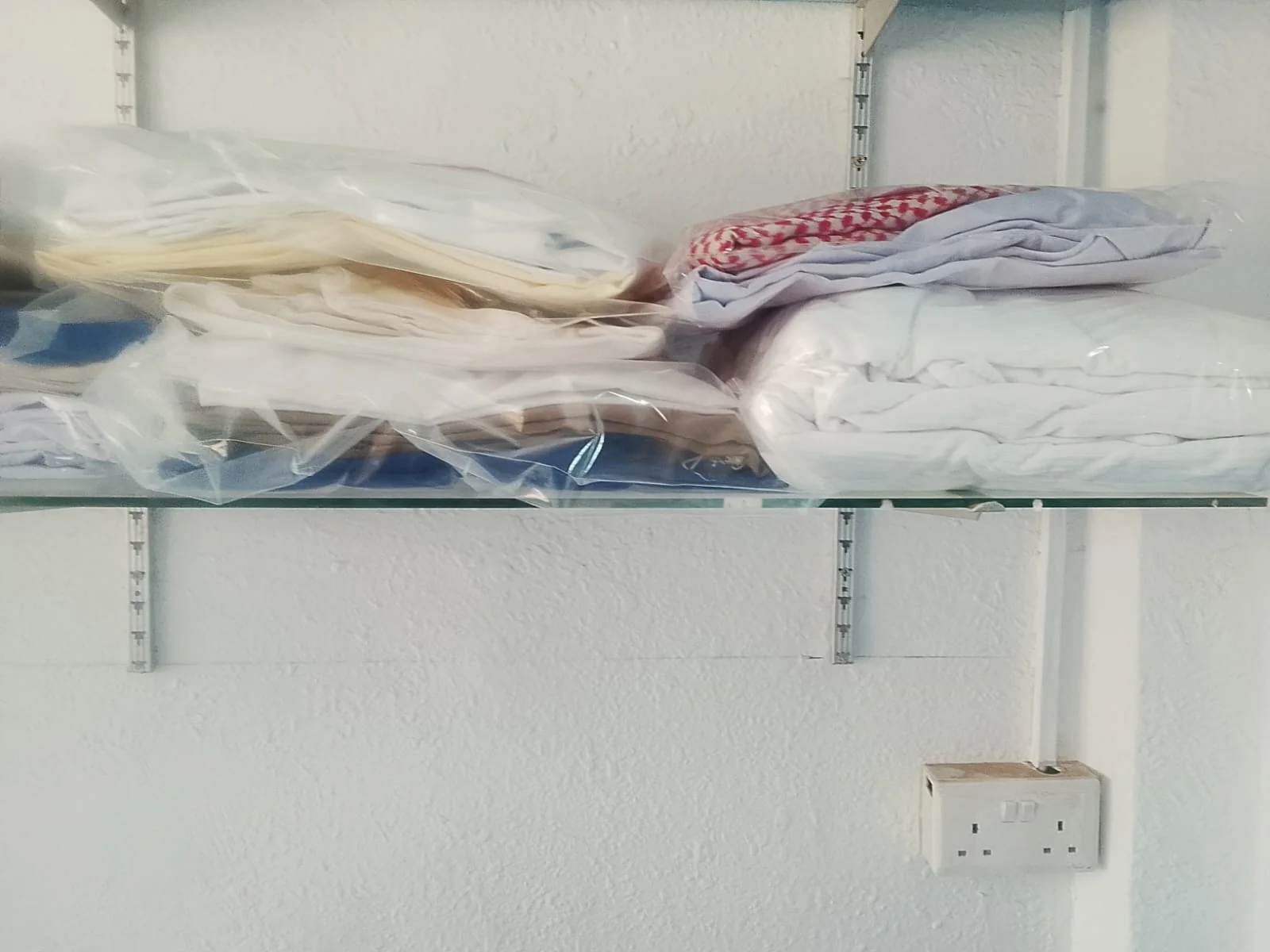 Clean folded bedding in protective packaging