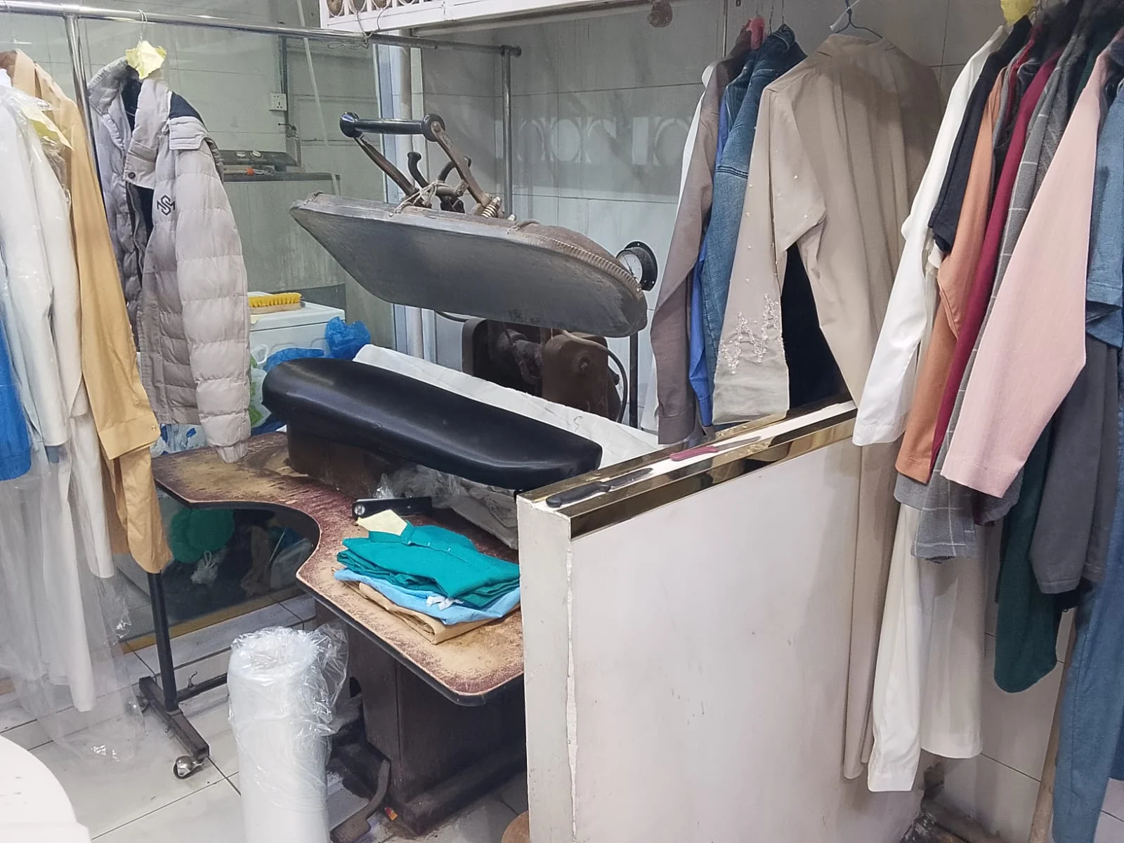 Pressing station and garments at Azdahar